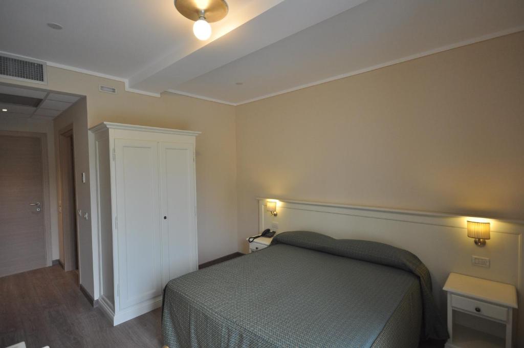 Postel nebo postele na pokoji v ubytování Hotel Panoramica