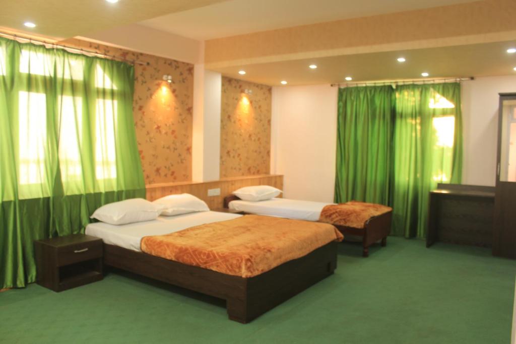 Postel nebo postele na pokoji v ubytování Hotel Paradiso