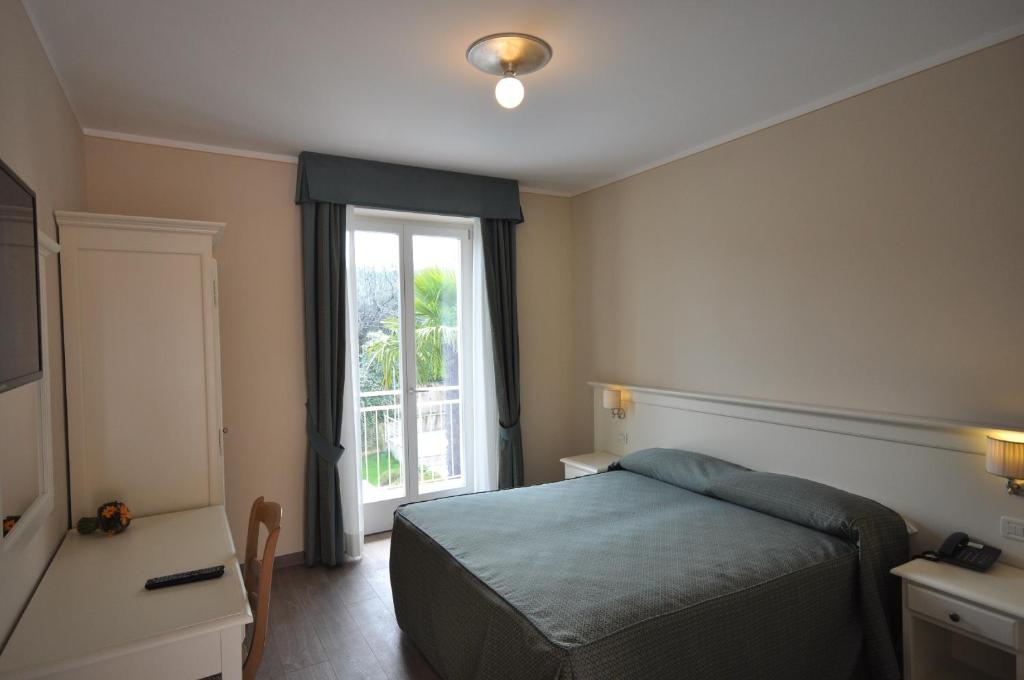 Postel nebo postele na pokoji v ubytování Hotel Panoramica