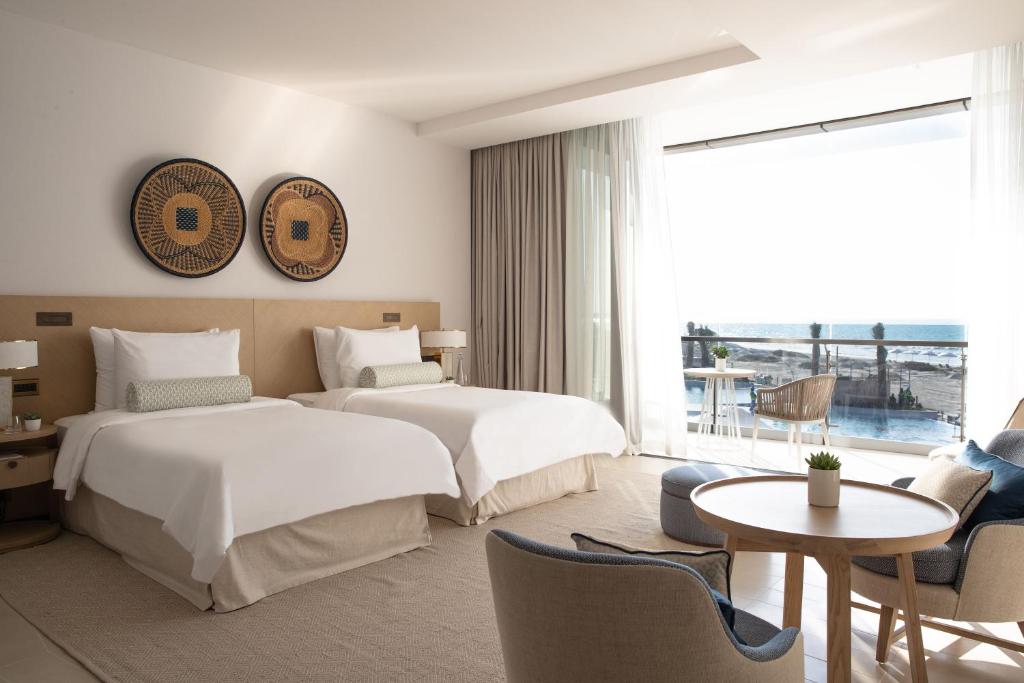 Voodi või voodid majutusasutuse Jumeirah Saadiyat Island Abu Dhabi toas