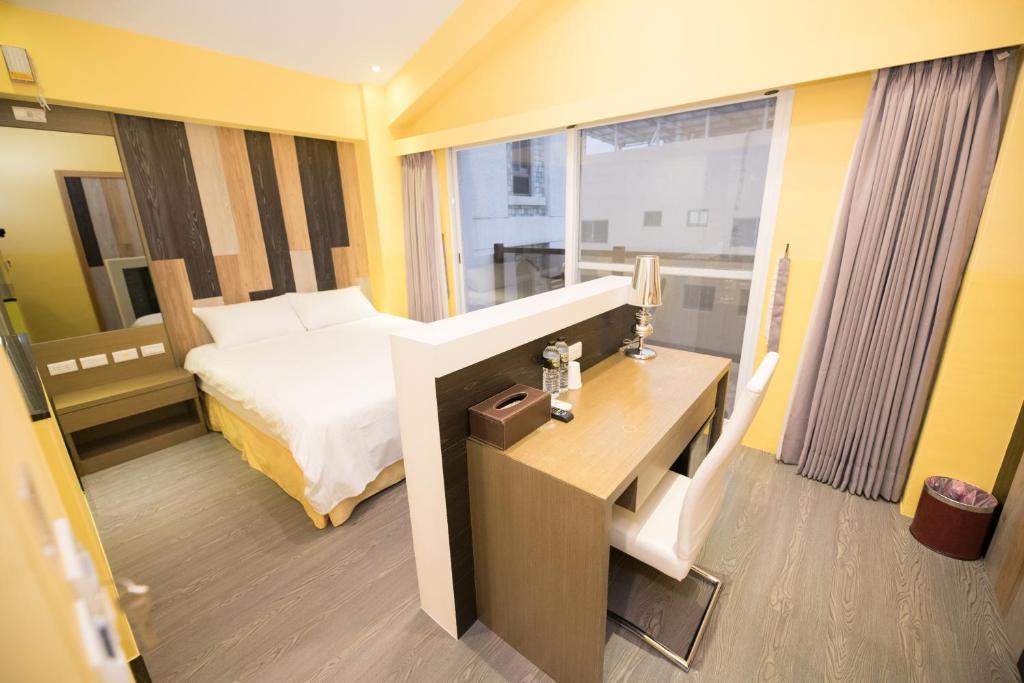 Postel nebo postele na pokoji v ubytování Banff-Penghu B&B