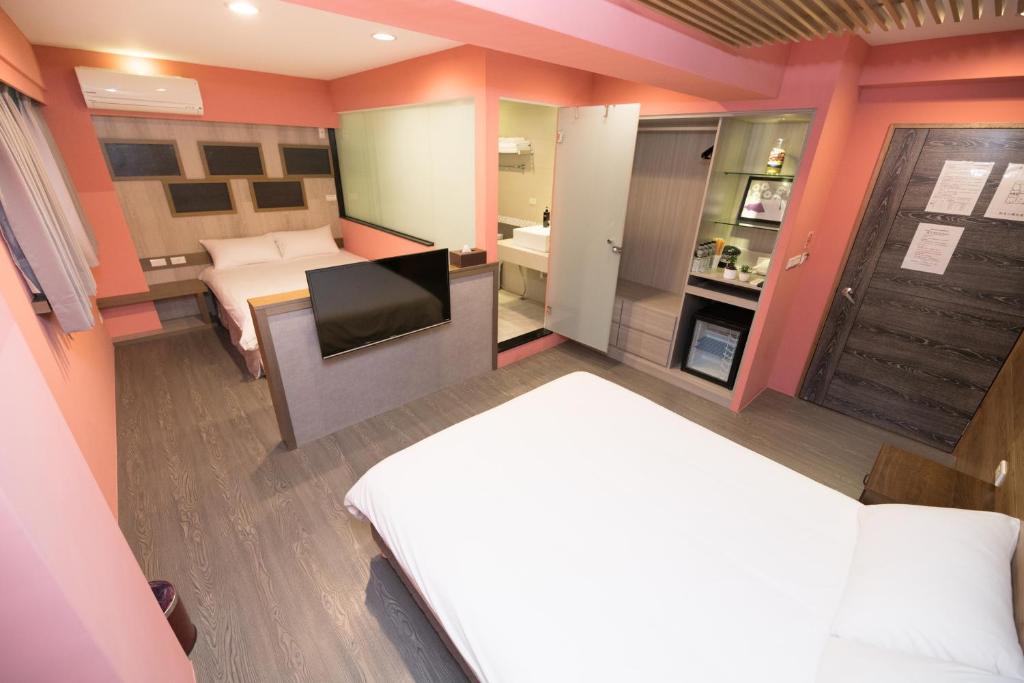 Postel nebo postele na pokoji v ubytování Banff-Penghu B&B