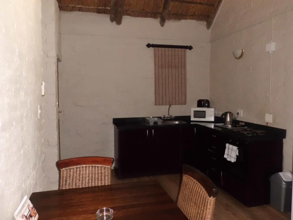 Η κουζίνα ή μικρή κουζίνα στο Bains Lodge