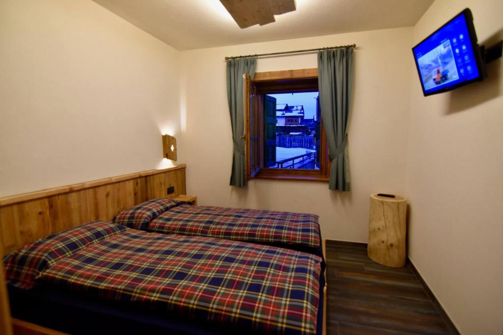 Кровать или кровати в номере Chalet Li Mina