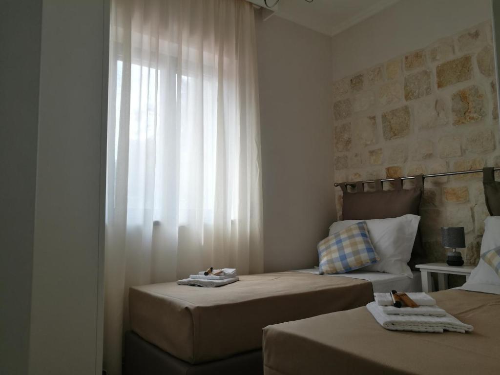 Postel nebo postele na pokoji v ubytování Hotel Residence La Corvetta
