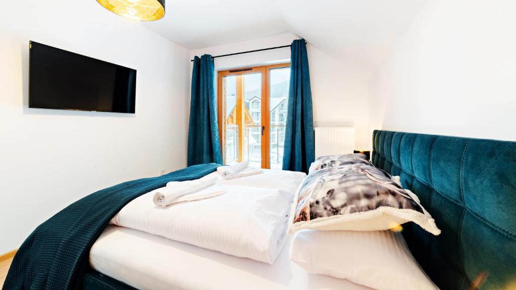 Posteľ alebo postele v izbe v ubytovaní Apartamenty Sun & Snow Sarnia Residence