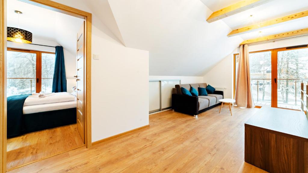 Posteľ alebo postele v izbe v ubytovaní Apartamenty Sun & Snow Sarnia Residence