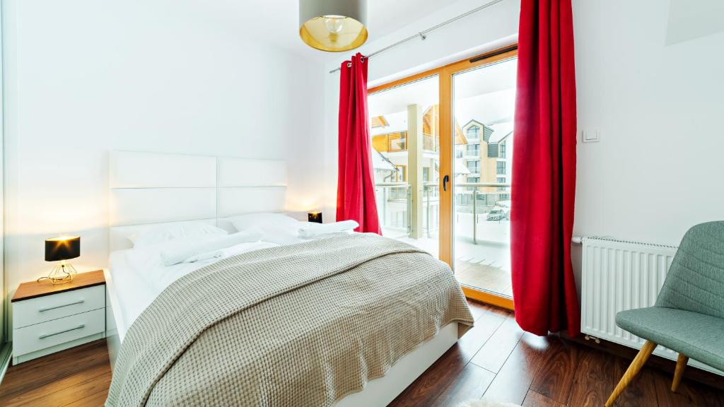 Posteľ alebo postele v izbe v ubytovaní Apartamenty Sun & Snow Sarnia Residence