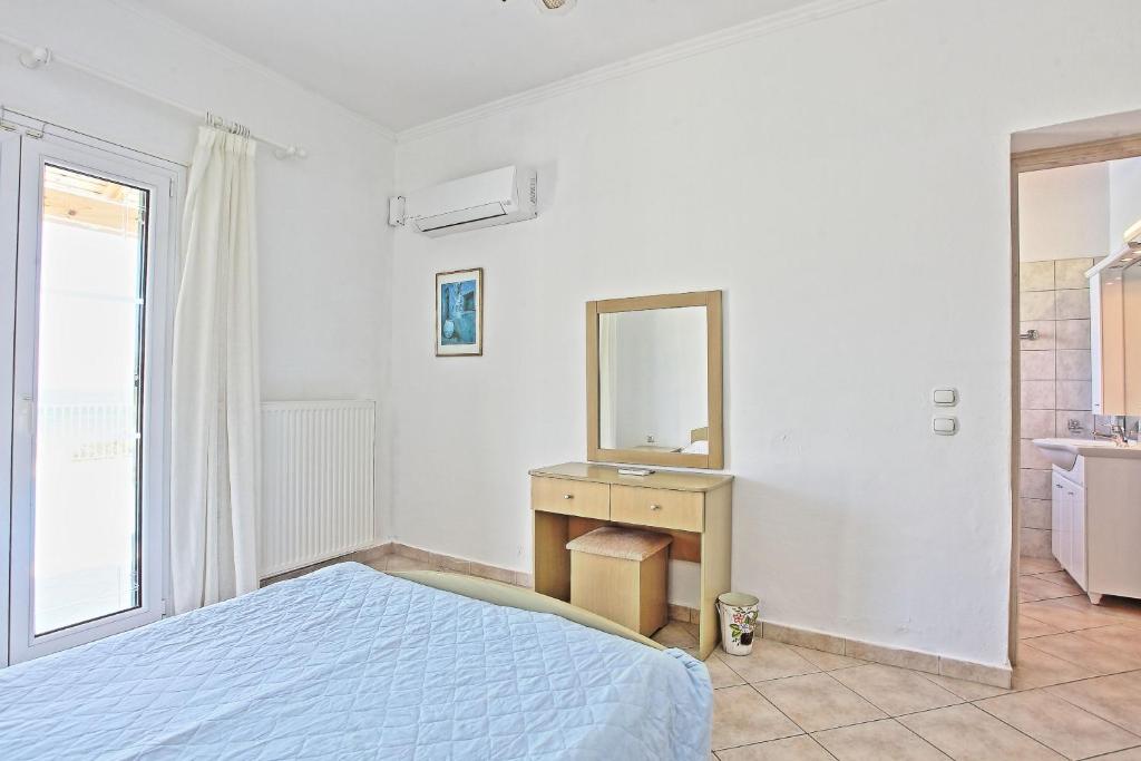 Postel nebo postele na pokoji v ubytování Beach Villa Oneiro