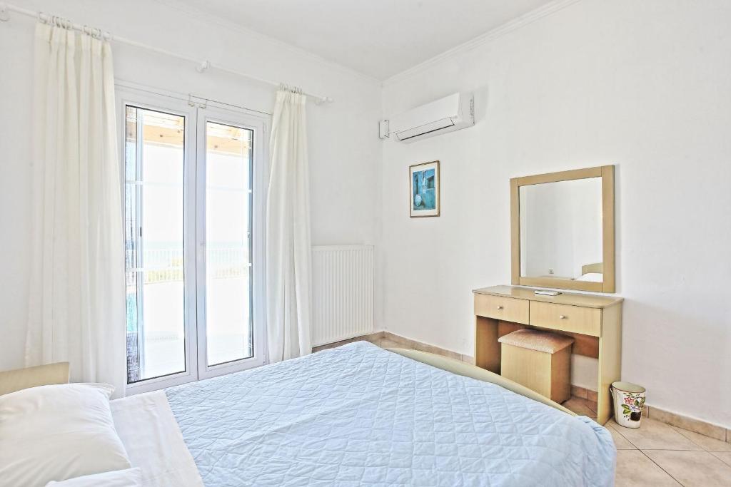Postel nebo postele na pokoji v ubytování Beach Villa Oneiro