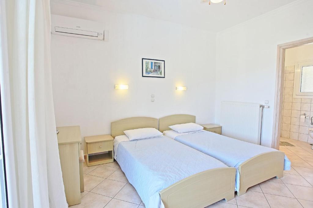 Postel nebo postele na pokoji v ubytování Beach Villa Oneiro