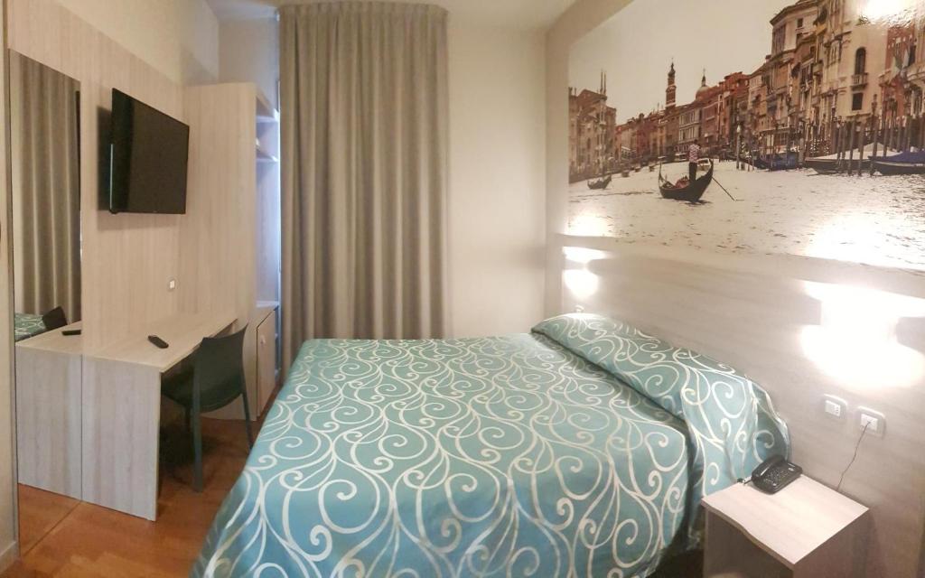 Postel nebo postele na pokoji v ubytování Hotel Altieri