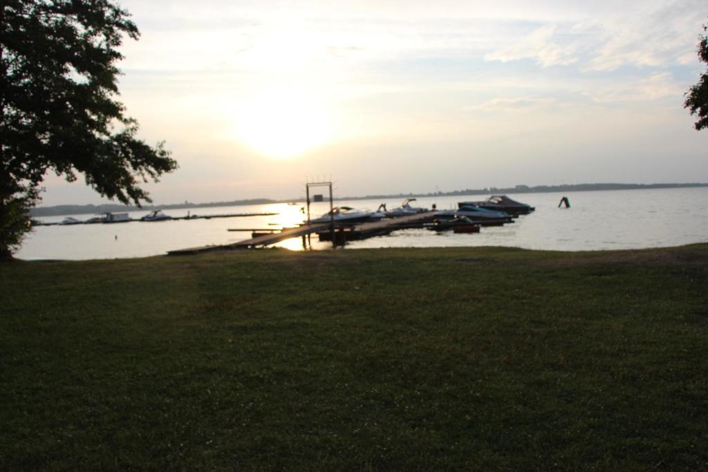 a group of boats docked at a dock on a lake at Waldchaussee 5 in Zislow