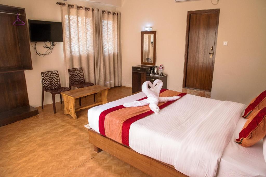 Llit o llits en una habitació de Hotel Himalayan Vacation