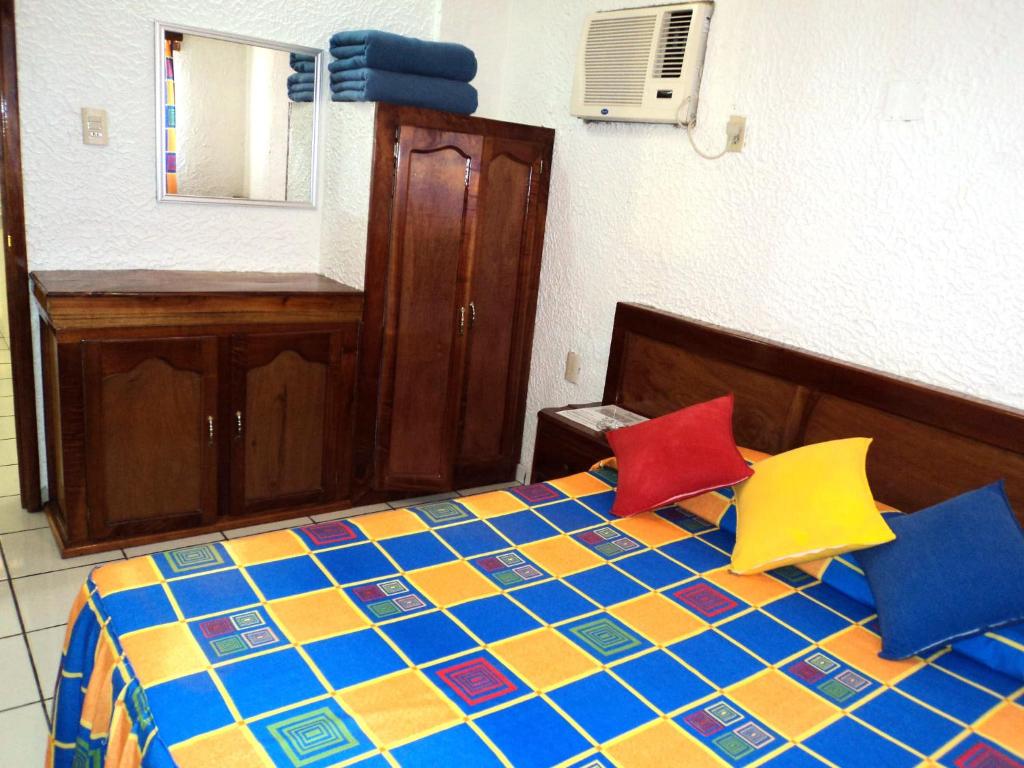 Postel nebo postele na pokoji v ubytování Canadian Resort Veracruz