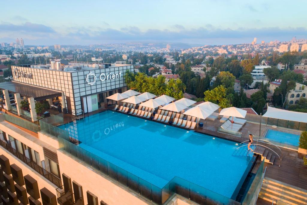 an overhead view of a swimming pool on top of a building at Orient by Isrotel Exclusive in Jerusalem