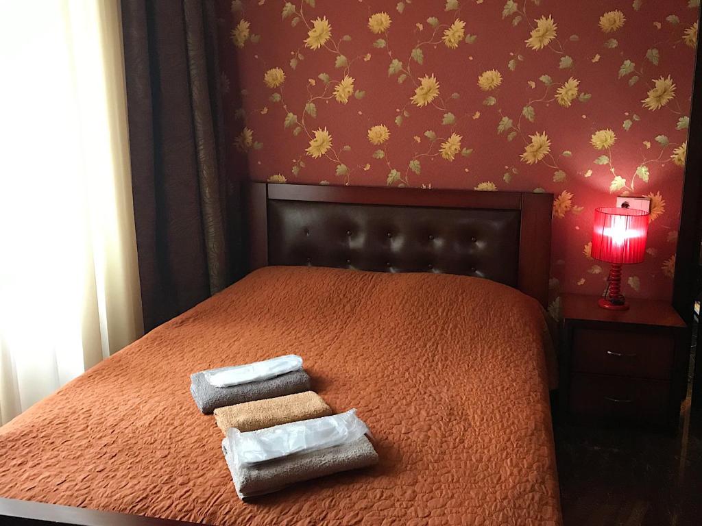 Postel nebo postele na pokoji v ubytování Hotel Aragvi