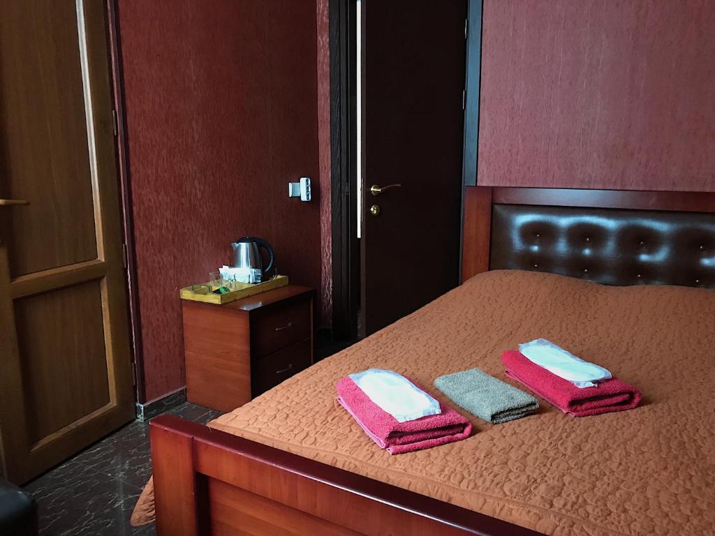 Postel nebo postele na pokoji v ubytování Hotel Aragvi