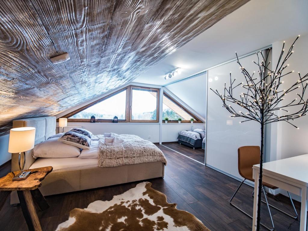 Posteľ alebo postele v izbe v ubytovaní Apartamenty Bawaria