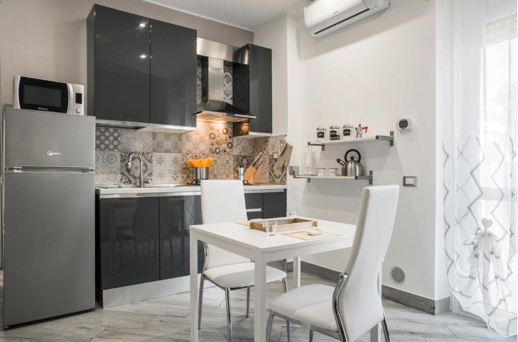 A kitchen or kitchenette at La Fiaba Roma Apartment