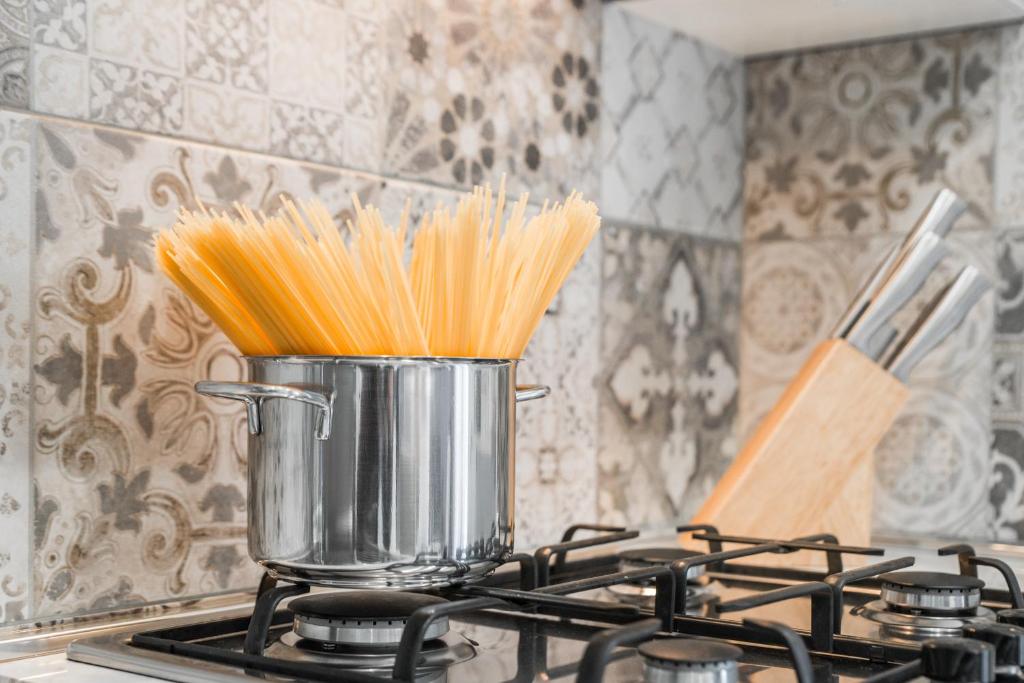 A kitchen or kitchenette at La Fiaba Roma Apartment