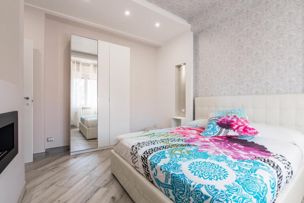 A bed or beds in a room at La Fiaba Roma Apartment