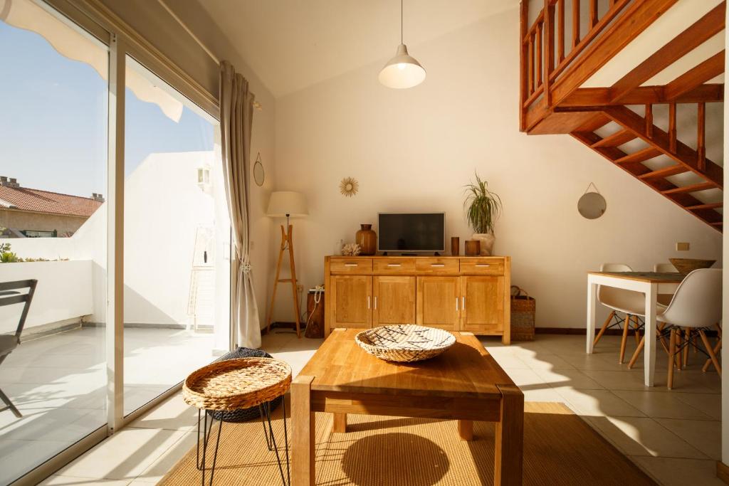 Televízia a/alebo spoločenská miestnosť v ubytovaní Bungalow Balancon duplex