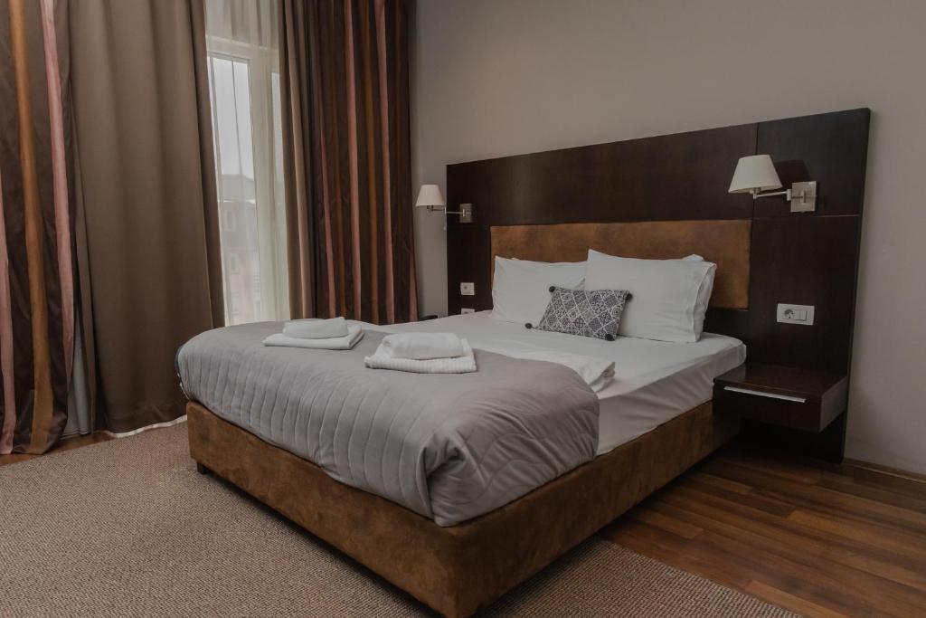 Postel nebo postele na pokoji v ubytování Hotel Dolce International