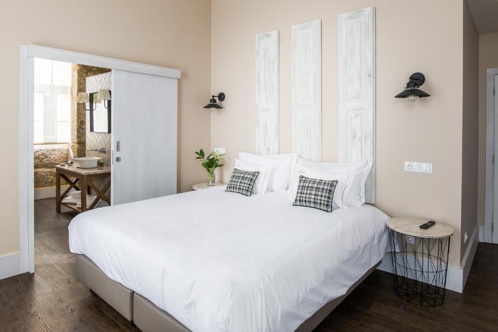 Uma cama ou camas num quarto em Casa das Muralhas