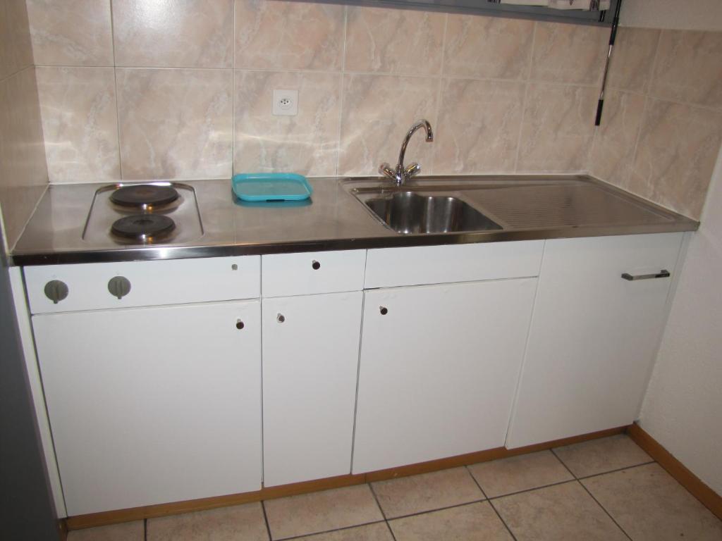 Kuchyň nebo kuchyňský kout v ubytování Residence Tell