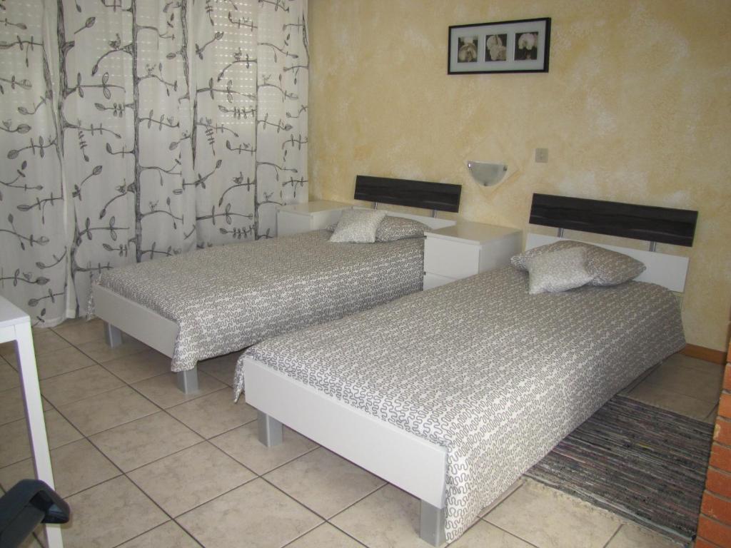 Postel nebo postele na pokoji v ubytování Residence Tell