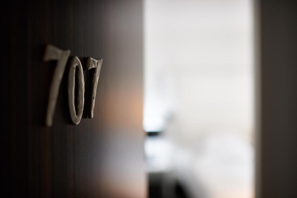 a close up of a door knob on a wall at Hôtel Le Windsor Biarritz in Biarritz