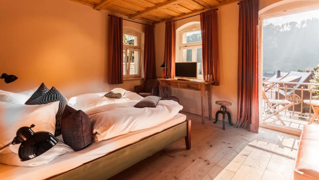 Postel nebo postele na pokoji v ubytování Bio-Hotel Zur Mühle