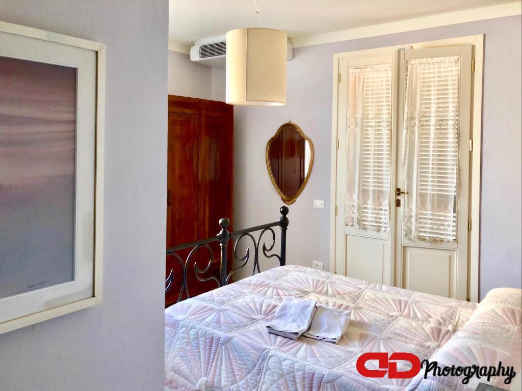 Posteľ alebo postele v izbe v ubytovaní B&B Orsobigio