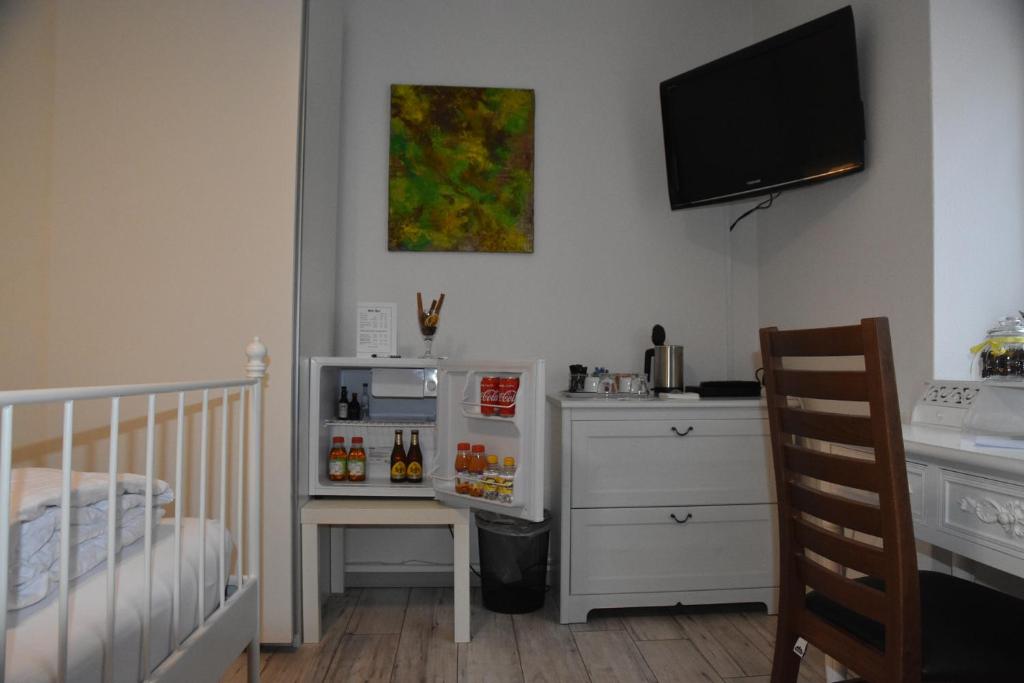 Postel nebo postele na pokoji v ubytování Kiki's B&B