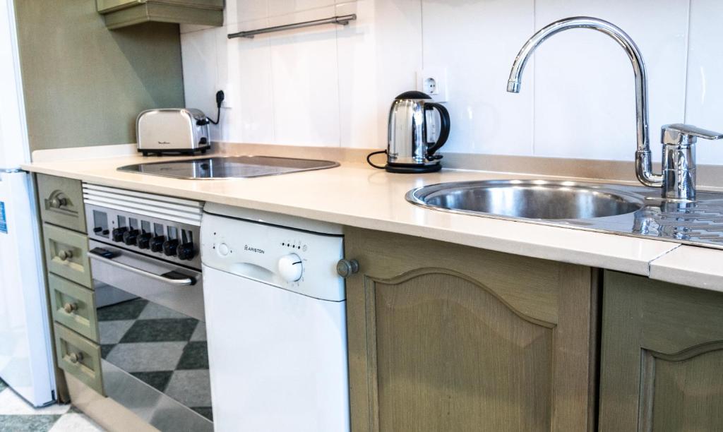 Kuchyň nebo kuchyňský kout v ubytování Apartamento Cadiz Paradiso