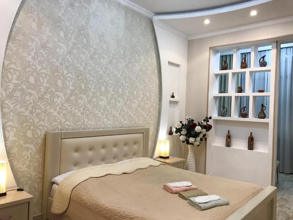 Postel nebo postele na pokoji v ubytování Hotel Aragvi
