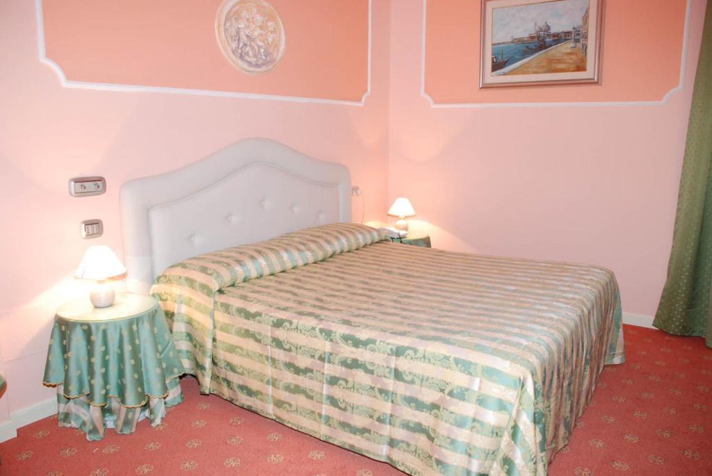 Postel nebo postele na pokoji v ubytování Hotel Il Burchiello