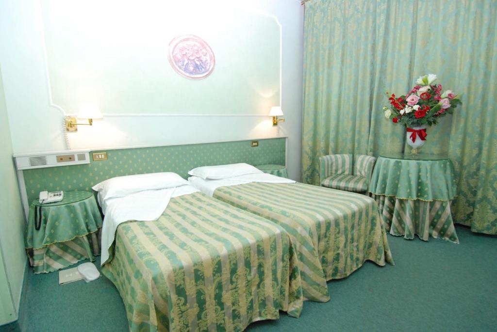 Postel nebo postele na pokoji v ubytování Hotel Il Burchiello