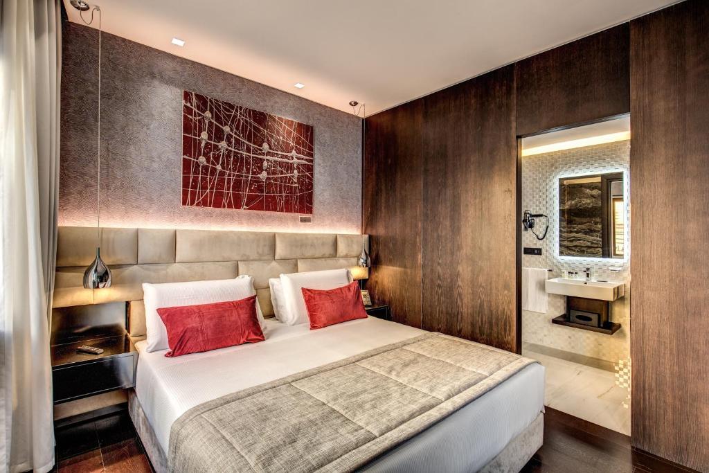 Кровать или кровати в номере Prassede Palace Hotel