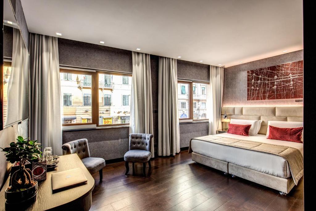 Postel nebo postele na pokoji v ubytování Prassede Palace Hotel