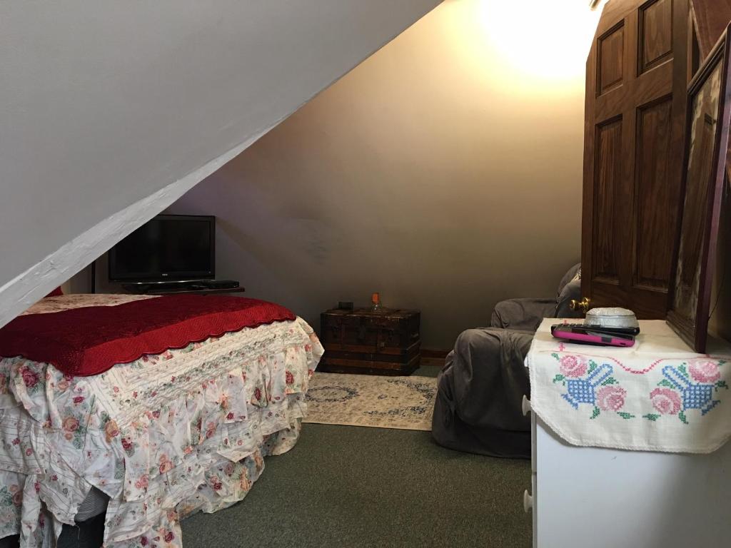 Postel nebo postele na pokoji v ubytování Inn Victoria