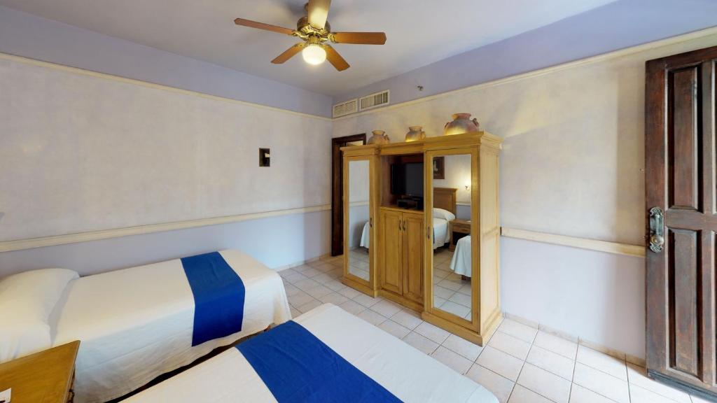 Postel nebo postele na pokoji v ubytování Hotel Boutique La Mision De Fray Diego