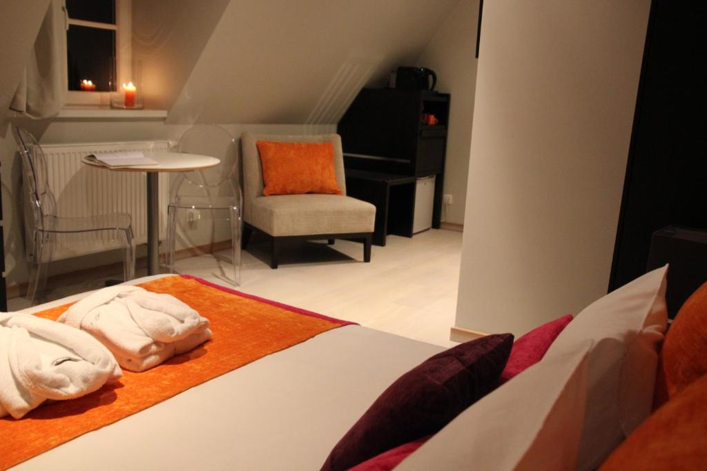 Postel nebo postele na pokoji v ubytování B&B L'Orangerie