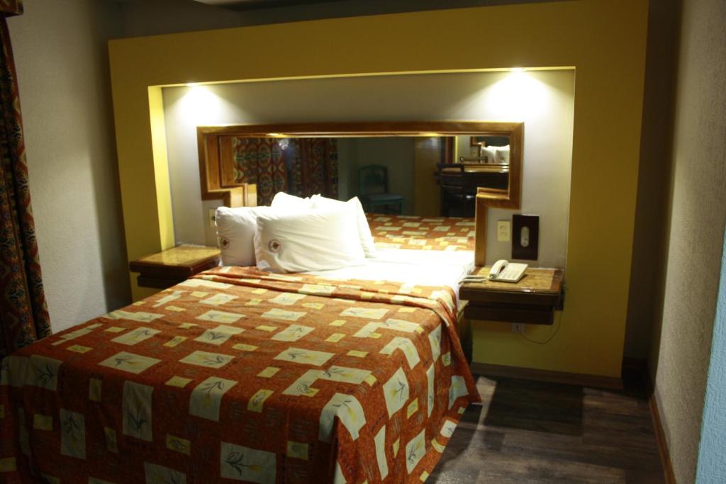 Postel nebo postele na pokoji v ubytování Hotel Mina