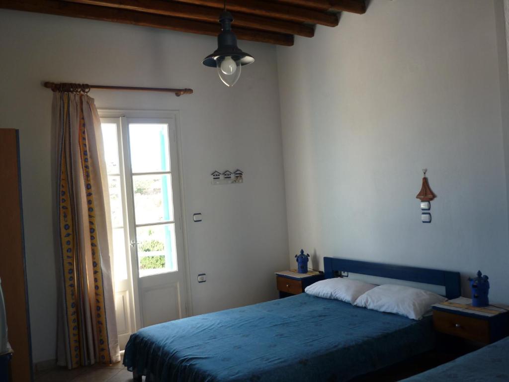 Postel nebo postele na pokoji v ubytování Smaragda Rooms & Studios