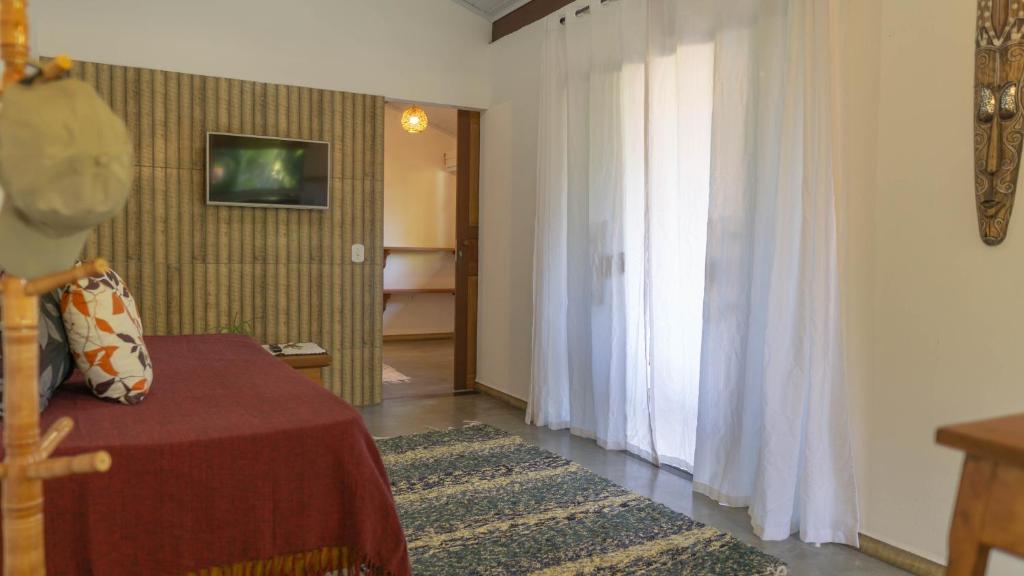 Postel nebo postele na pokoji v ubytování Chalés das Cores