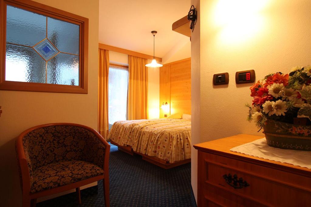 Postel nebo postele na pokoji v ubytování Hotel Al Lago