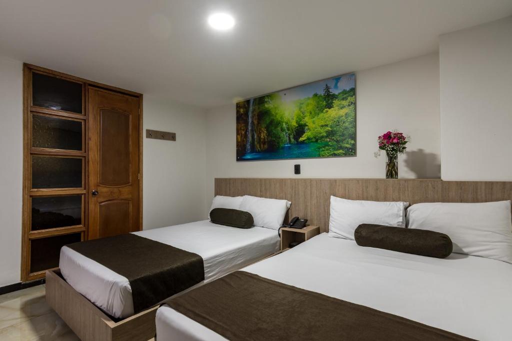 Postel nebo postele na pokoji v ubytování Hotel Med Estadio