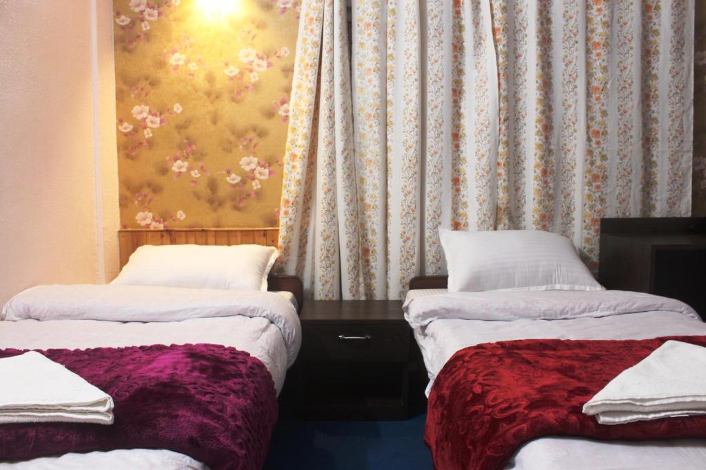 Postel nebo postele na pokoji v ubytování Hotel Paradiso